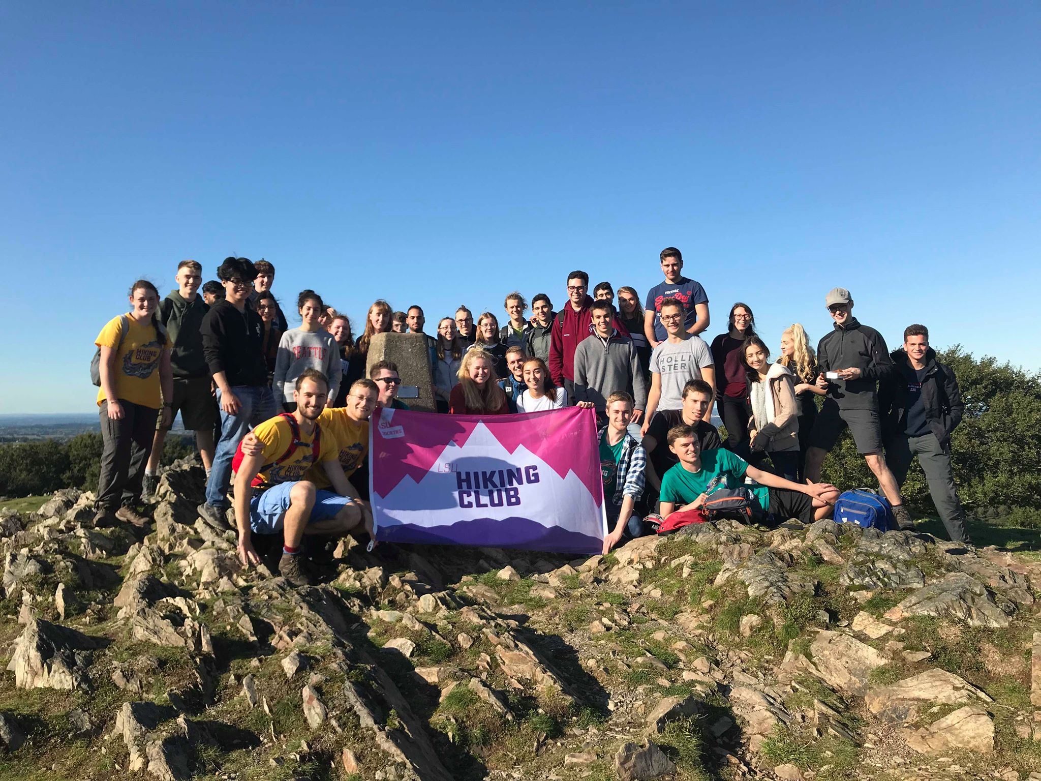 a group of people on a rocky outcrop